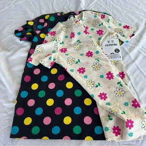 NWT two girls patterned short sleeved shirts.